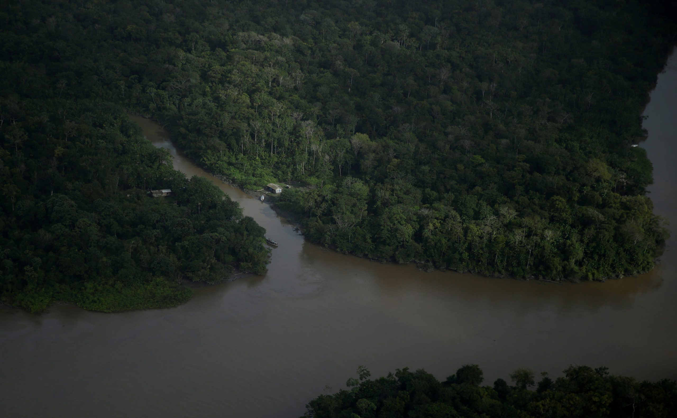 A house stands among rivers next to the mouth of Amazonas River on the coast of Amapa state, near Macapa city, northern Brazil, March 31, 2017.