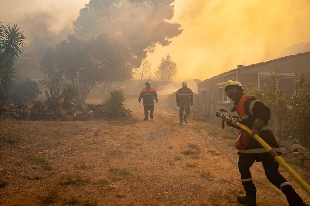 Firefighters battling a wildfire in southern France on 5 August. Credit: Associated Press