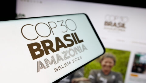 In this photo illustration, a smartphone with the logo of UN climate change conference COP30 in Brazil is seen on screen in front of website.