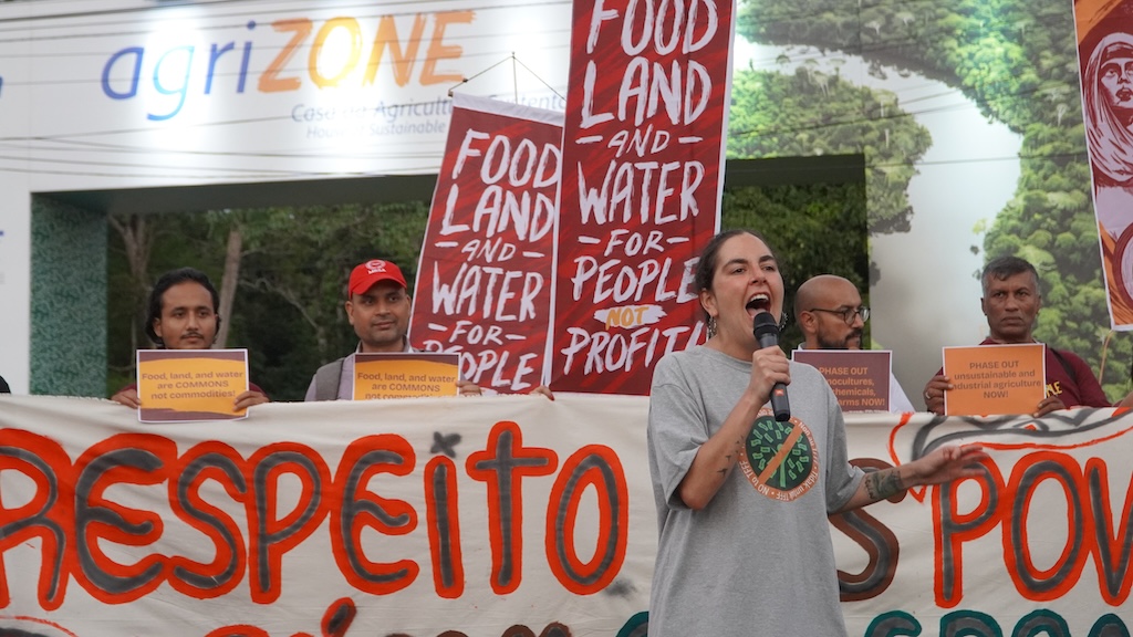 Civil society and farmers’ groups protest at the industry-sponsored “AgriZone” on the first day of COP30. Credit: Jason Valenzuela, Asian Peoples’ Movement on Debt and Development (2025)