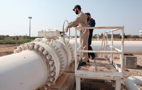 Workers operate the pipelines with natural gas, coming from Turkey and Azerbaijan, following the launch of natural gas exports to Syria, in Aleppo, Syria, August 2, 2025. REUTERS/Mahmoud Hassano