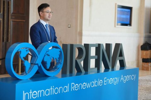 The logo of the International Renewable Energy Agency outside the plenary room at its 16th Assembly in Abu Dhabi, UAE