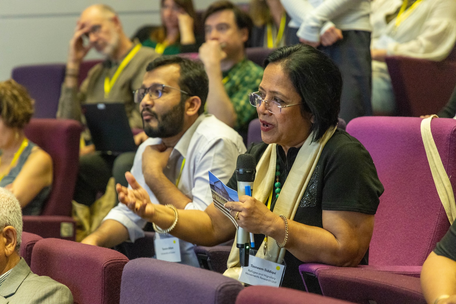 Conference attendees asking questions to the panel.