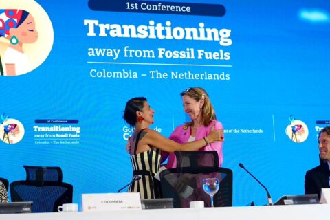 The climate and environment ministers of Colombia and the Netherlands, which are co-hosting the Santa Marta conference, embrace on the podium during the high-level segment in Santa Marta, Colombia