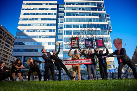 A small group of climate activists gather in front of the International Monetary Fund (IMF) and the World Bank Group 2025 Annual Meeting on October 16, 2025 in Washington, DC.