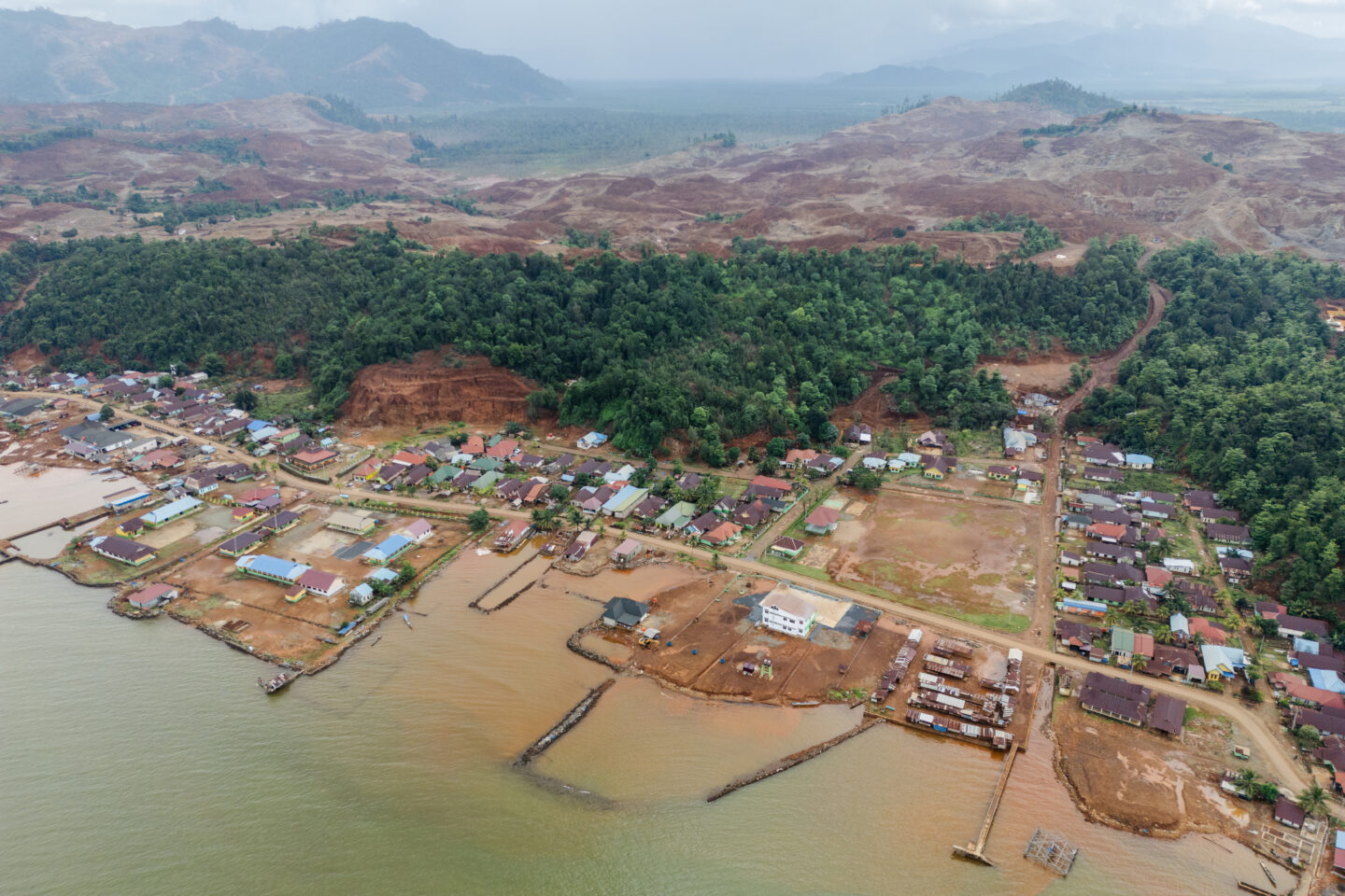 A coastal village is wedged between the sea and a large nickel mine in Indonesia