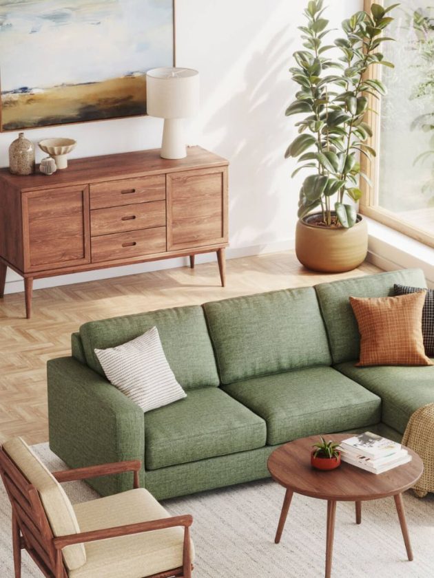 green sofa and wood buffet table in living room