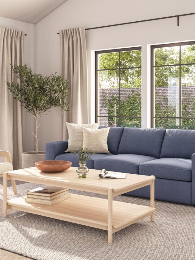Blue sofa and light wood coffee table from sustainable furniture company Medley
