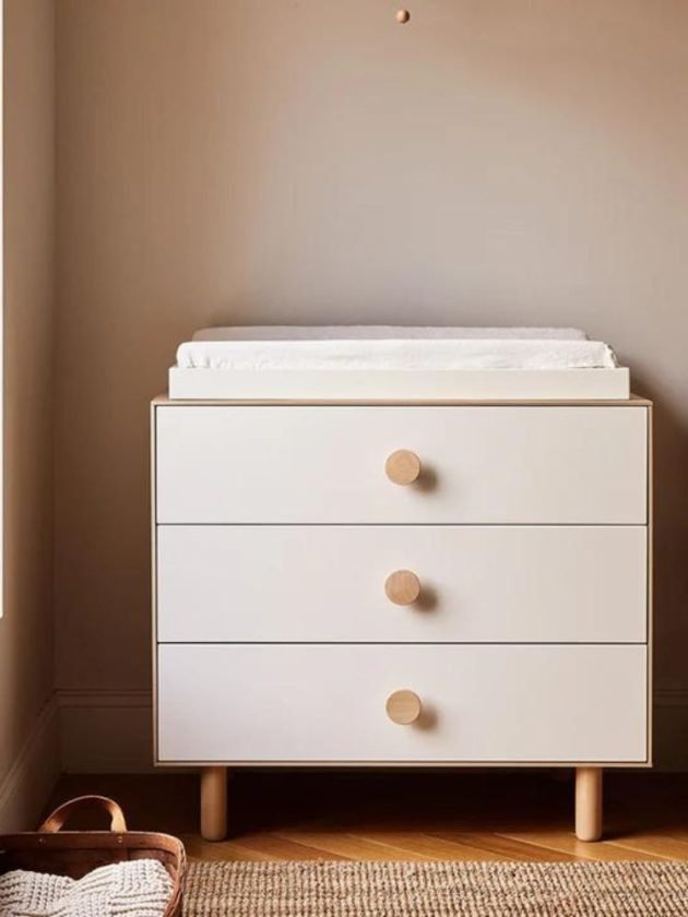 White and light wood small non-toxic dresser with changing table in nursery