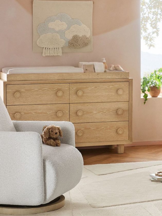 Rustic light wood non-toxic dresser with changing table in pink nursery